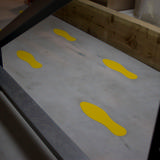 Zelfklevend vloermarkeringssymbool, Voetafdruk