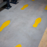 Zelfklevend vloermarkeringssymbool, Voetafdruk